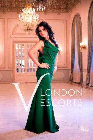 Lora in a classy emerald dress at ball