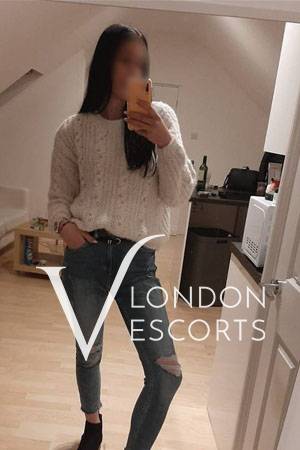 Jessika selfie wearing jeans and a jumper